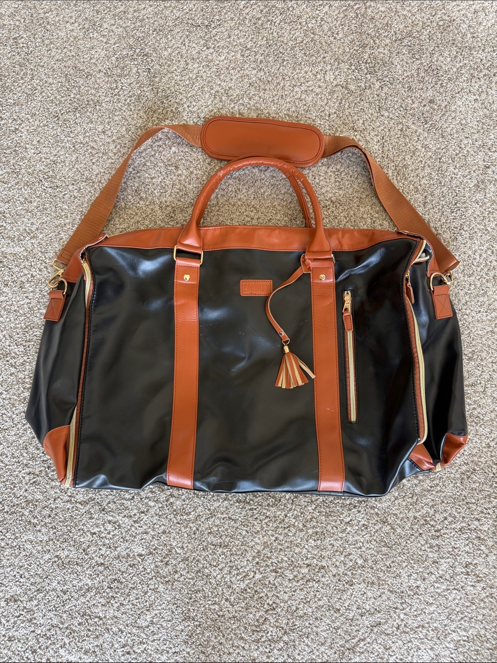 Black and Tan Shoulder Duffel Bag with Tassel Accent